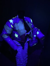 a man wearing a glow in the dark jacket