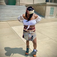 a woman wearing a skirt with a picture on it